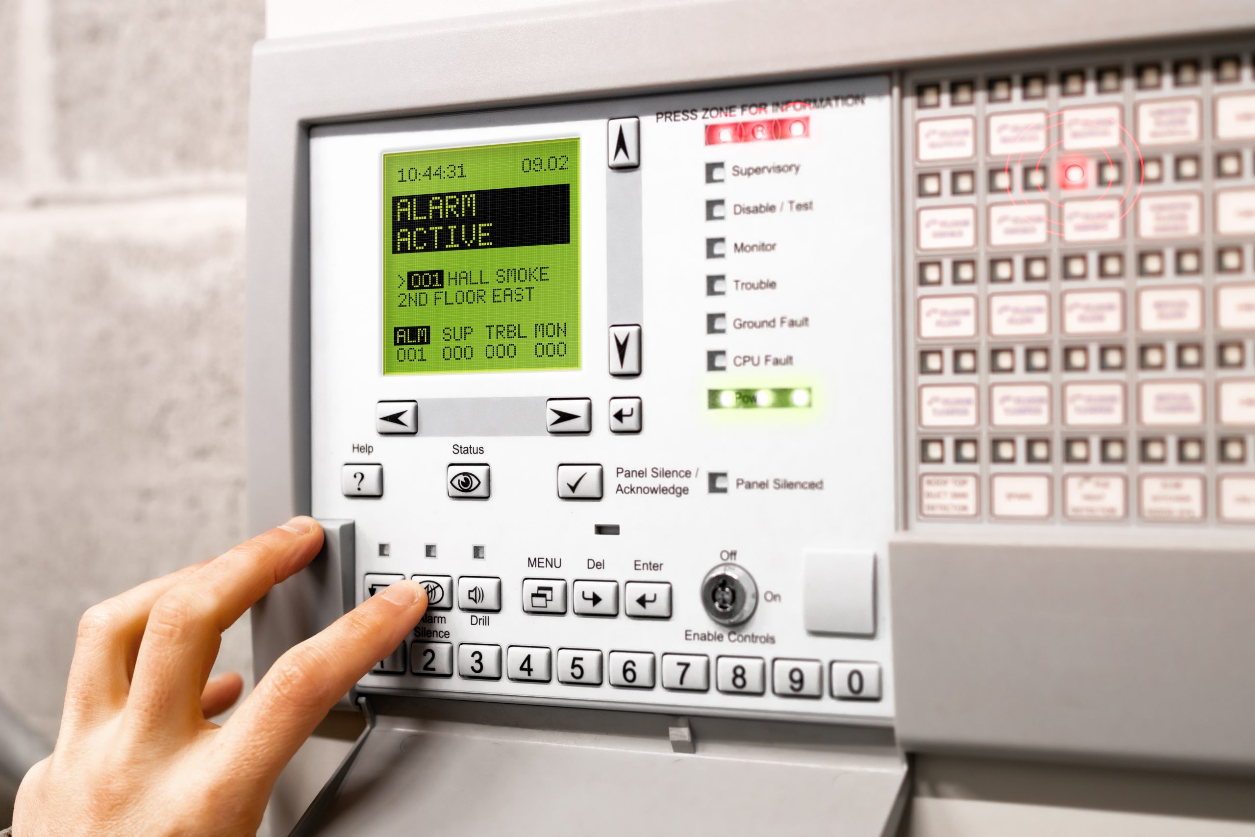 Fire alarm control panel is activated and in alert mode. Display